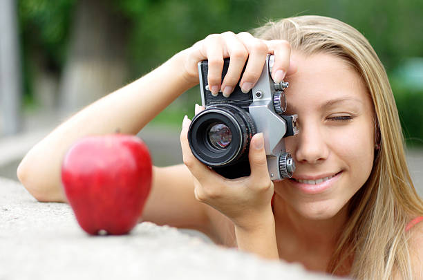 photographer and apple stock photo