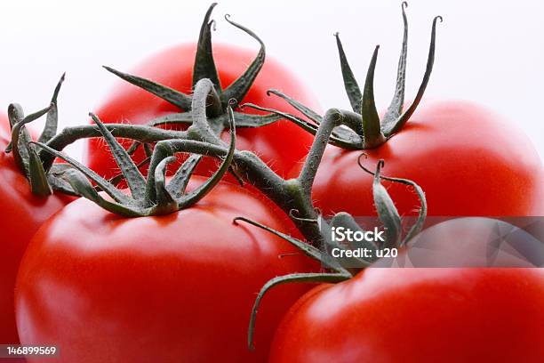 Group Of Red Tomatos Closeup Stock Photo - Download Image Now - Cut Out, Dieting, Extreme Close-Up