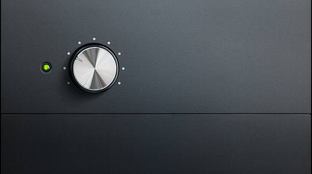 amplifier detail degrading black surface of amplifier with one knob and green warning led volume knob photos stock pictures, royalty-free photos & images