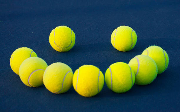 istock Tennis balls smile (focus on the left 