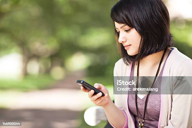 Mixed Race Student Texting Stock Photo - Download Image Now - Adolescence, Standing, Teenager