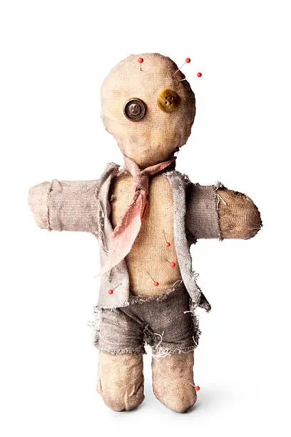 business man voodoo doll with needles on white