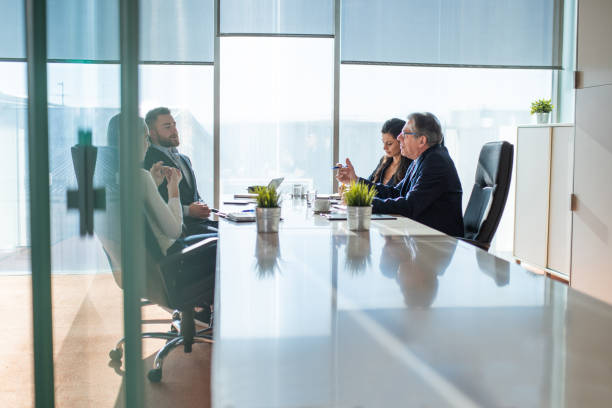 istock Businesspeople Debating Their New Strategy At Office Work Table 1469003748