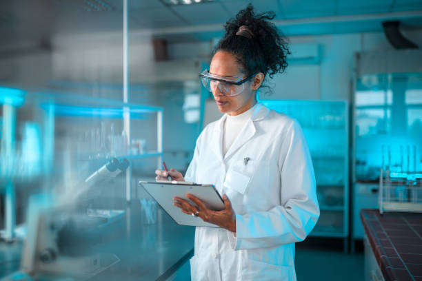 istock Beautiful Multiracial Female Scientist at Work 1469005115