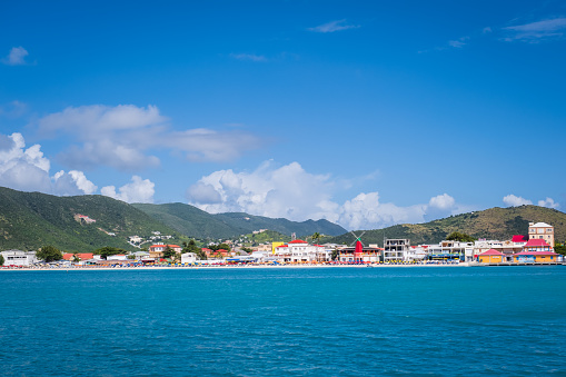 Philipsburg, Sint Maarten viewed from the water. Saint Martin is one of the Leeward Islands of the Lesser Antilles. The island is comprised of two separate countries; the southern portion is the Dutch country of Sint Maarten and the northern portion is French.