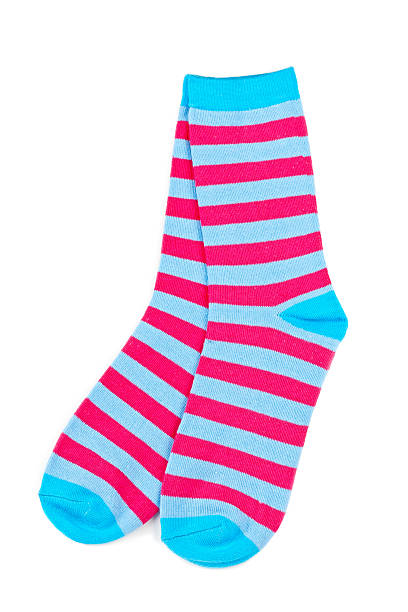 istock Pair of bright blue and pink striped socks on a white back 146900820