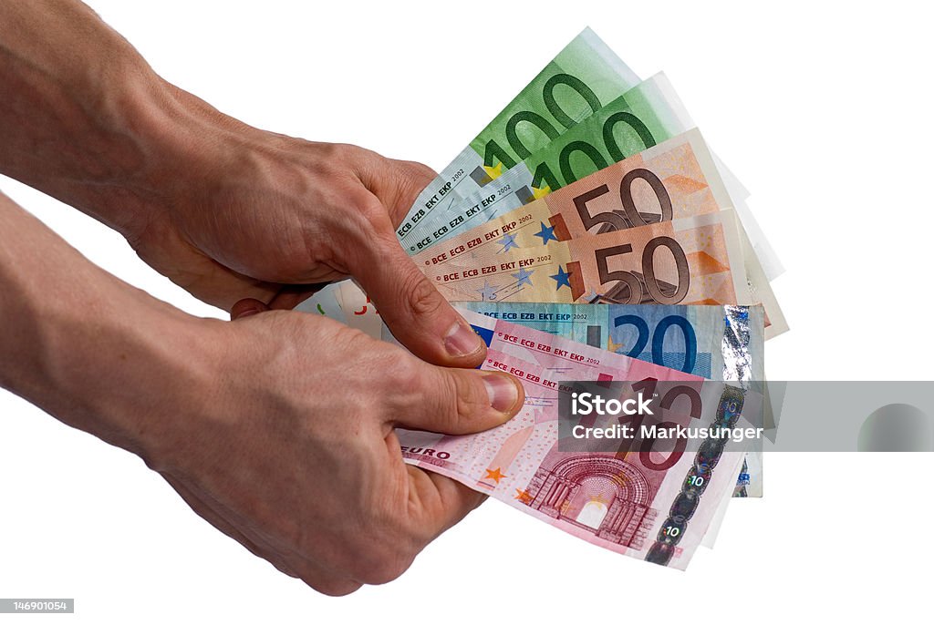 Man holding money fan. Isolated male hands holding different colored Euro notes like a fan. Banking Stock Photo