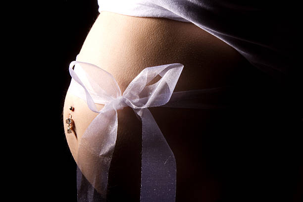 Pregnant Belly with Bow stock photo
