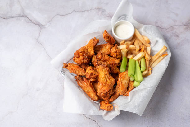 istock Buffalo chicken wings with celery and dip 1469014620