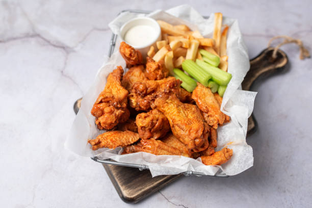 istock Buffalo chicken wings with celery and dip 1469014794