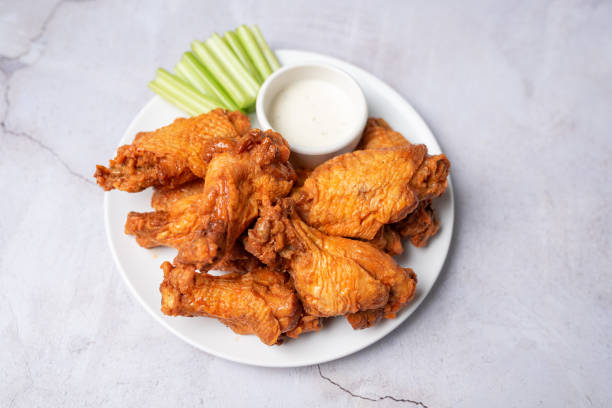 istock Buffalo chicken wings with celery and dip 1469014972