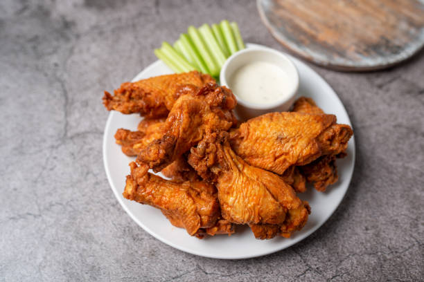 istock Buffalo chicken wings with celery and dip 1469015646