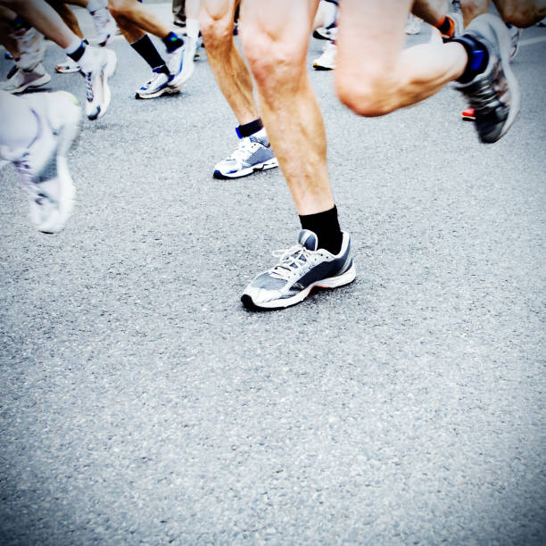 istock Man running marathon on city street 146901609