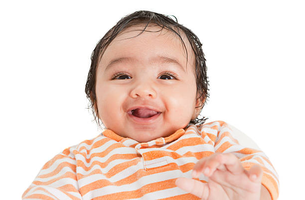 Portrait of a Smiling Newborn Baby Girl on White Background stock photo
