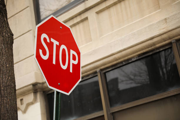 istock Stop sign in public road warning at intersection and law and order 1469023981