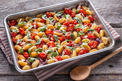 Sheet Pan Gnocchi with Tomato, Parmesan Cheese, Basil and Red Onion