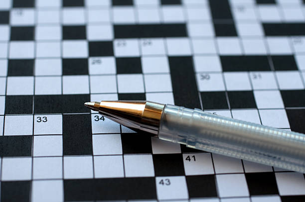 istock Crossword puzzle and pen 146902511