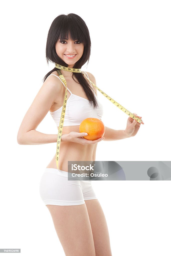 Hübsche Frau mit orange und Maßnahme Klebeband - Lizenzfrei Abnehmen Stock-Foto