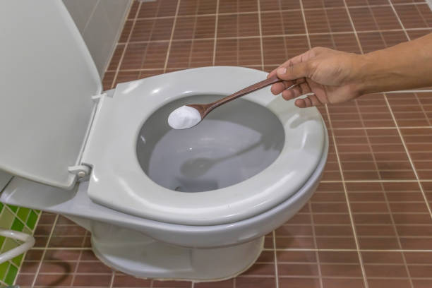 istock man cleaning toilet bowl 1469027578