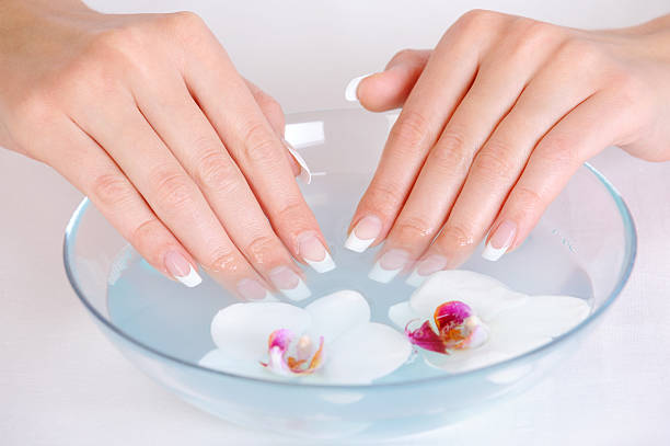 istock female putting her beautiful fingers into water 146902823