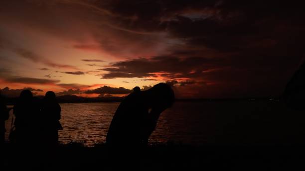 istock someone on the lake and the evening sunset 1469029357