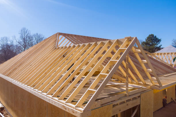 Roofing framework for a new beam stick home was constructed using trusses during the construction of new home