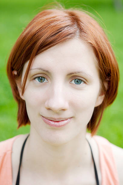 portrait of smiling red hair woman stock photo