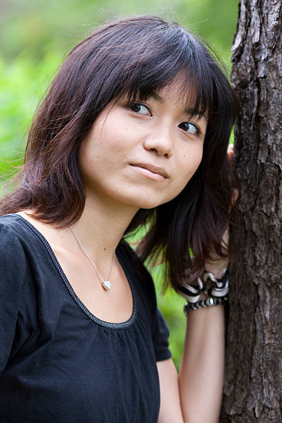 istock Japanese woman next to a tree 146904123