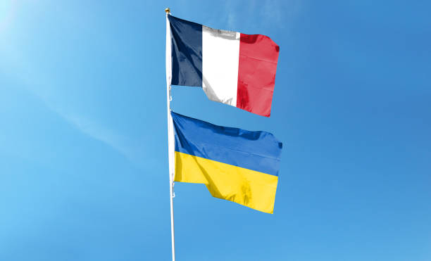 istock French flag and Ukrainian flag on cloudy sky 1469042192