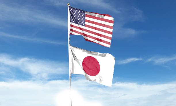 istock American flag and Japanese flag on cloudy sky 1469043668