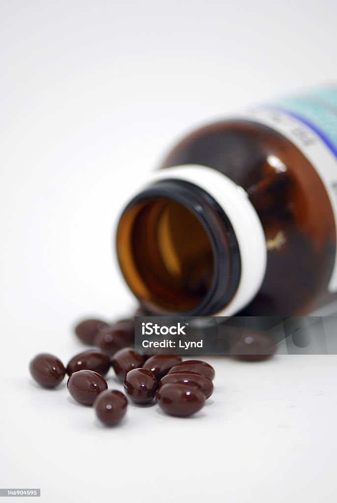 Vitamin A tablet a close up of Vitamin A tablet. Capsule - Medicine Stock Photo