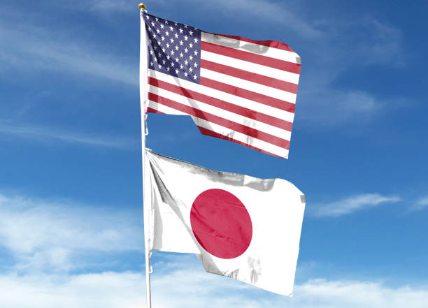istock American flag and Japanese flag on cloudy sky 1469046815
