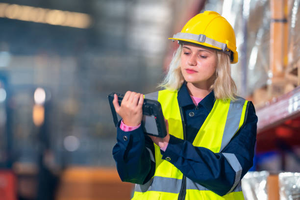 istock Technology help our information data management for warehouse with effective cost. Females warehouse worker use the digital tablet that intregated with barcode scanner . She use these for improve and intergrated data for sendingin the warehouse. 1469047363