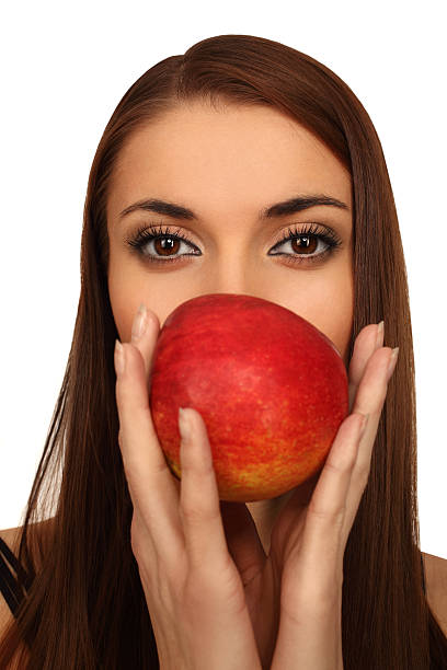 The girl with a apple stock photo