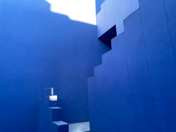 Calpe, Spain - 6 November 2022: The postmodern complex building 'La Muralla Roja', the blue wall, by architect Ricardo Bofill
