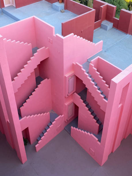 Calpe, Spain - 6 November 2022: The postmodern complex building 'La Muralla Roja', the red wall, by architect Ricardo Bofill