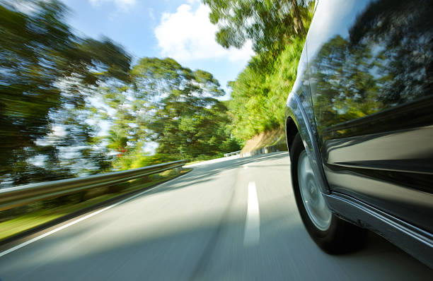 istock Black SUV speeding down narrow curved road 146906377