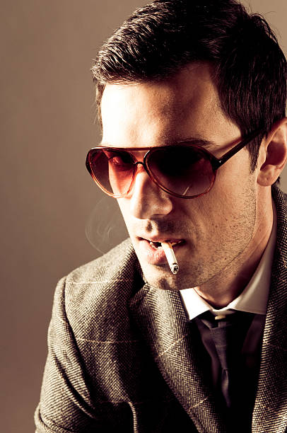 istock 70's fashion man with cigarette 146906416