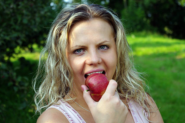istock Woman eating apple 146906756
