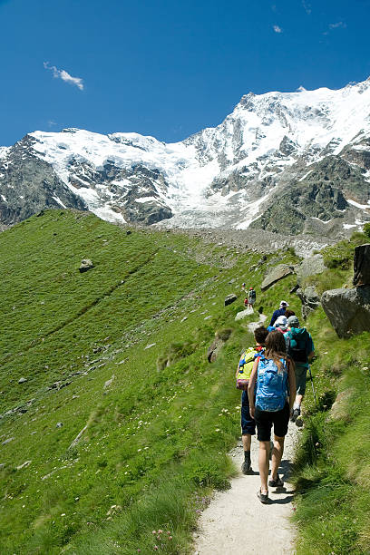 istock young people trekking on a alpes mountain route 146907052