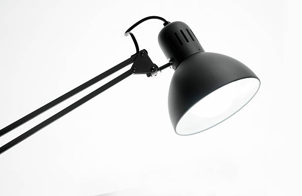 Photo of a desk lamp isolated Photo of a desk lamp isolated desk lamp photos stock pictures, royalty-free photos & images