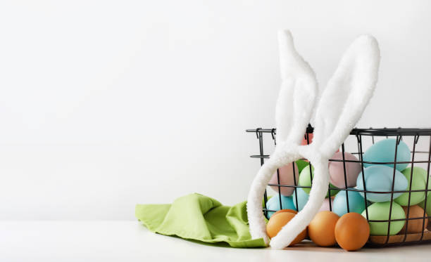 istock Dyed Easter eggs in the basket. Bunny ears. Easter holiday concept. 1469080802