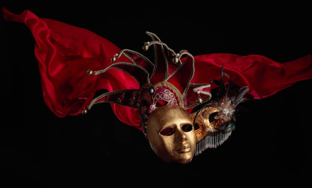istock Old carnival masks with flutters red cloth. 1469081665