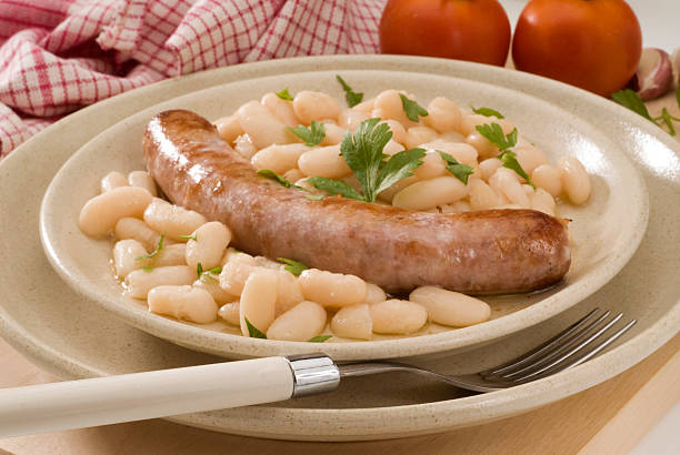 Spanish cuisine.Sausage with beans, Catalan style. stock photo