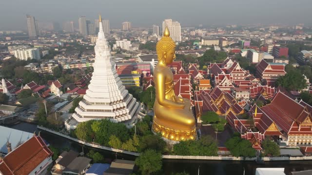 An aerial view of the Giant Buddha and Pagoda at Wat Paknam Phasi Charoen Temple, The most famous tourist attraction in Bangkok, Thailand