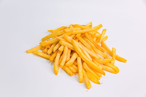Crispy Fried French Fries Chips on a White Background