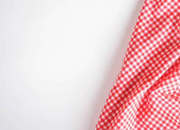 istock crumple pink plaid fabric or classic tablecloth on white background with copy space 1469086493