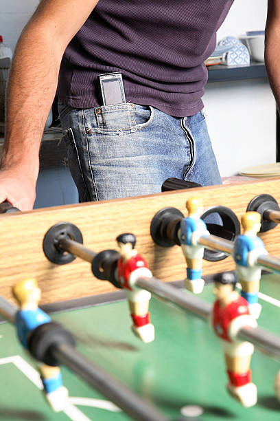 istock Young Man playing table football 146908895