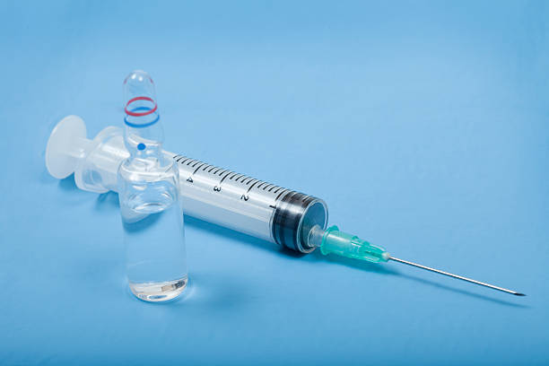 Medicine Vial and Syringe stock photo