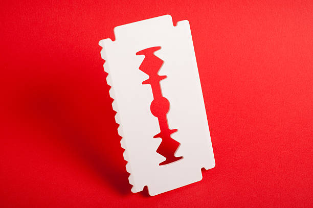 Big white razor blade used as ice scraper stock photo